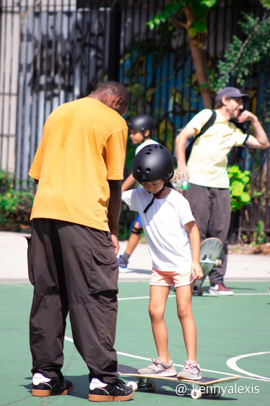 Leon Toppin giving a private one-on-one skateboard lesson