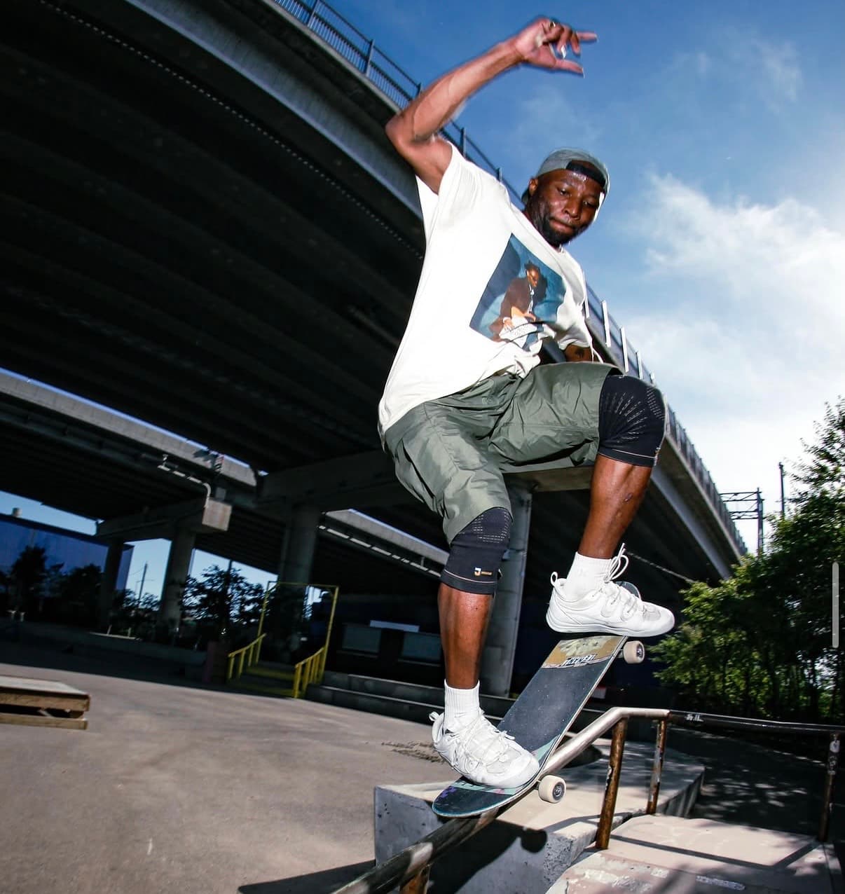 Leon Toppin grinding a rail at a skatepark