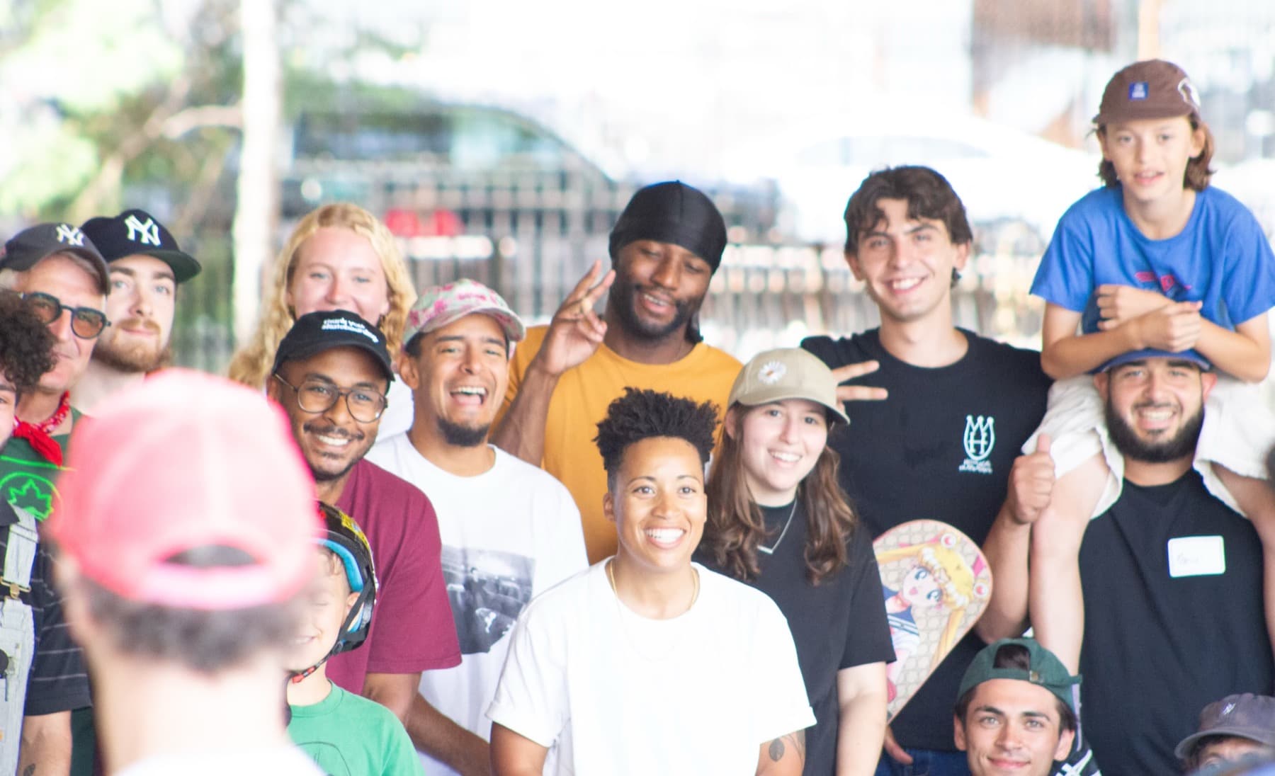 Leon Toppin with a group of skaters after a skateboard session at a New York park